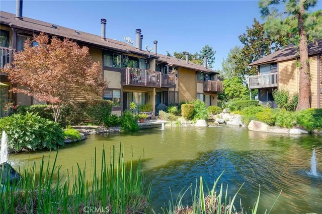 a view of a lake with a house in the background