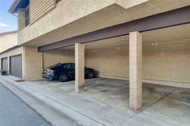 a view of a livingroom with a large space and large windows