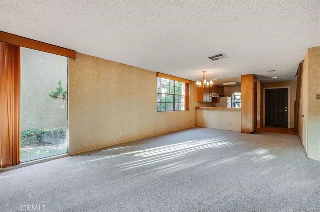 a view of an empty room and window