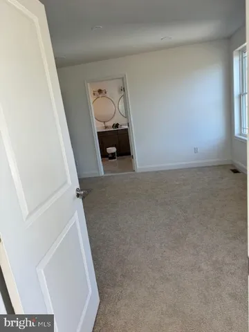 a view of livingroom and hardwood floor