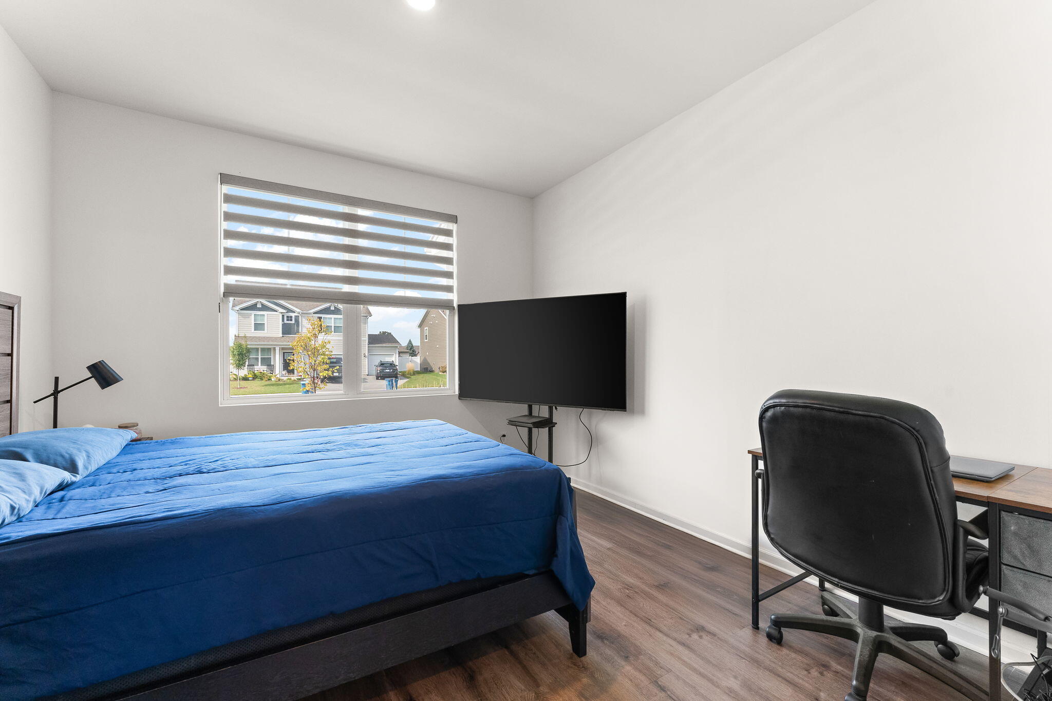 10453 Privet Drive Crown Point, IN 46307 - Photo 17 of 38 a bedroom with a bed and a chair