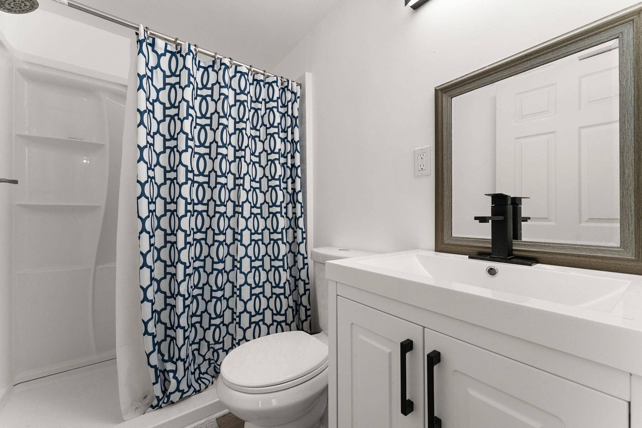 10453 Privet Drive Crown Point, IN 46307 - Photo 30 of 38 a bathroom with a sink a toilet and shower