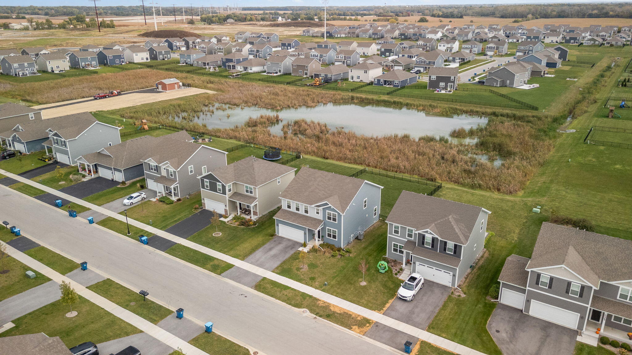 10453 Privet Drive Crown Point, IN 46307 - Photo 4 of 38 an aerial view of a city with a lake