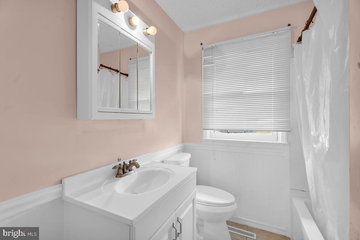 418 Westminster Road Wenonah, NJ 08090 - Photo 14 of 28 a bathroom with a sink toilet and a mirror