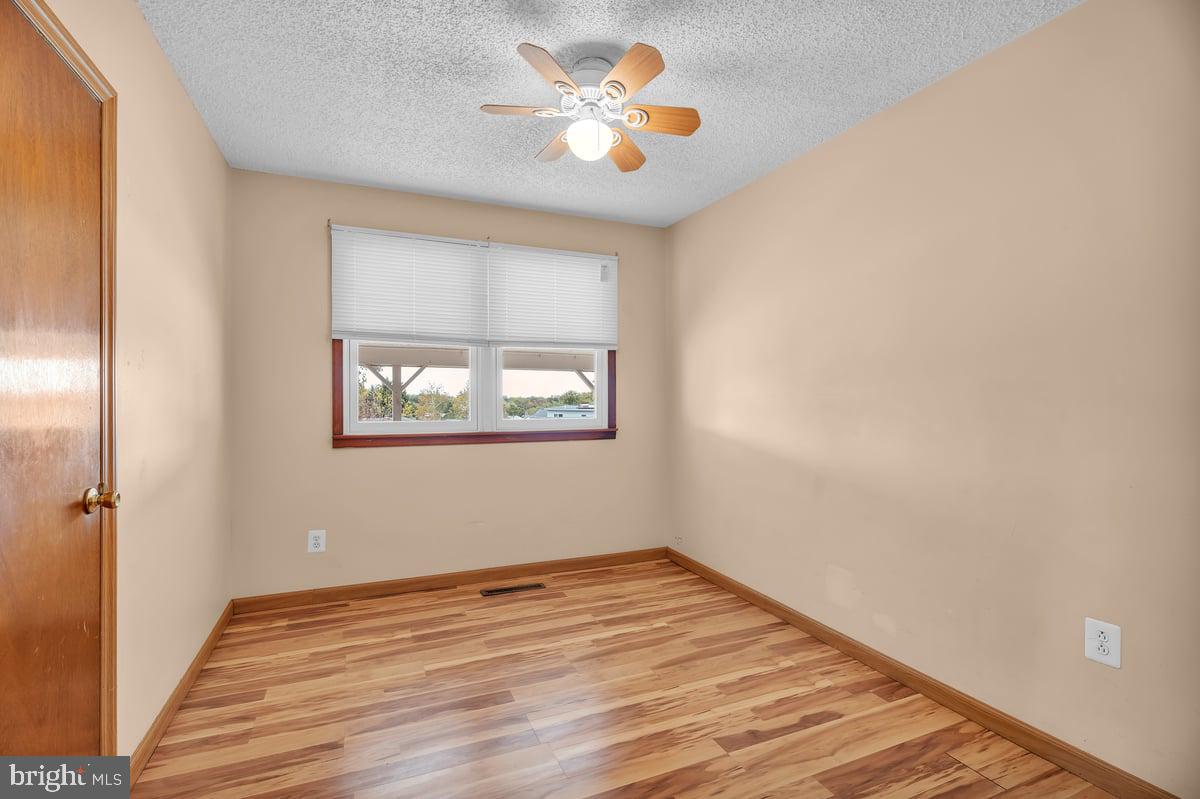 418 Westminster Road Wenonah, NJ 08090 - Photo 16 of 28 a view of empty room with wooden floor