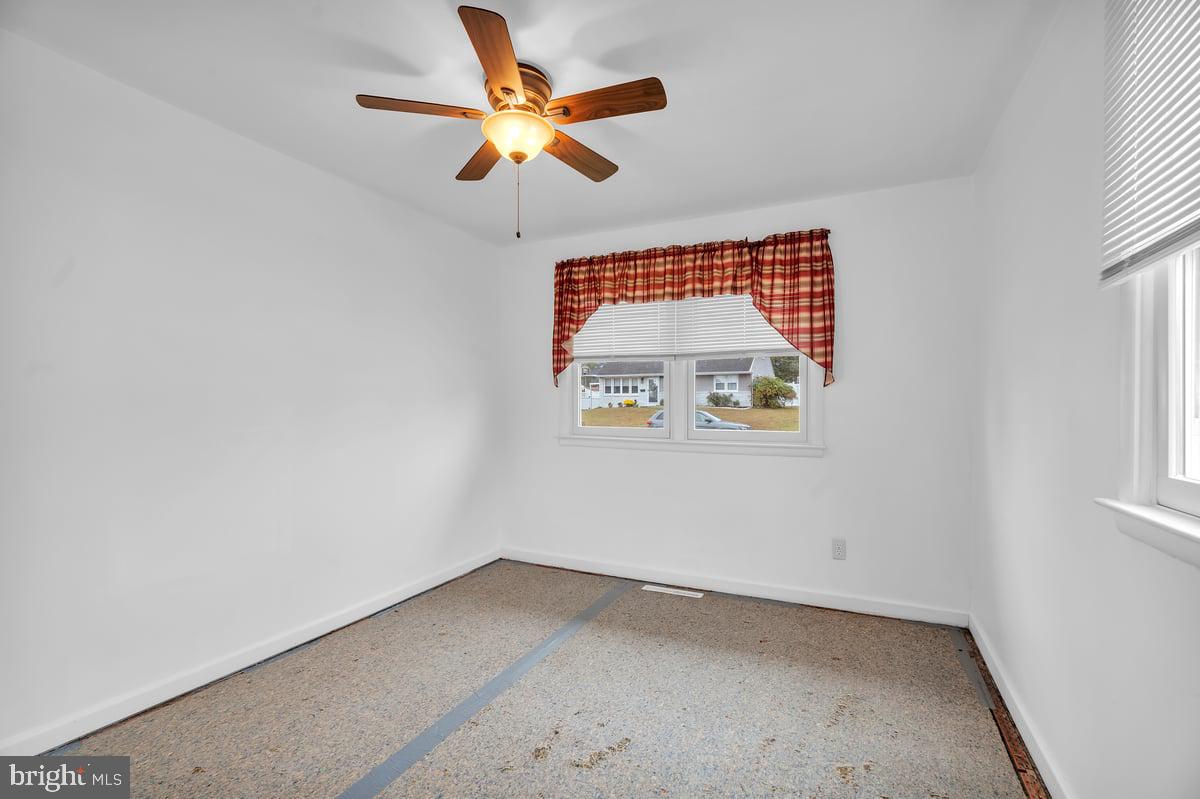 418 Westminster Road Wenonah, NJ 08090 - Photo 18 of 28 an empty room with a window and a ceiling fan