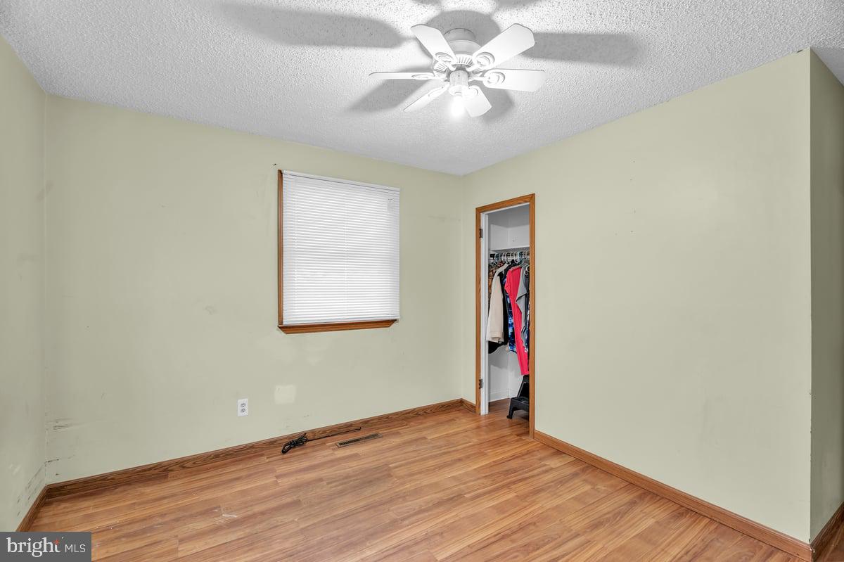 418 Westminster Road Wenonah, NJ 08090 - Photo 20 of 28 a view of an empty room with wooden floor