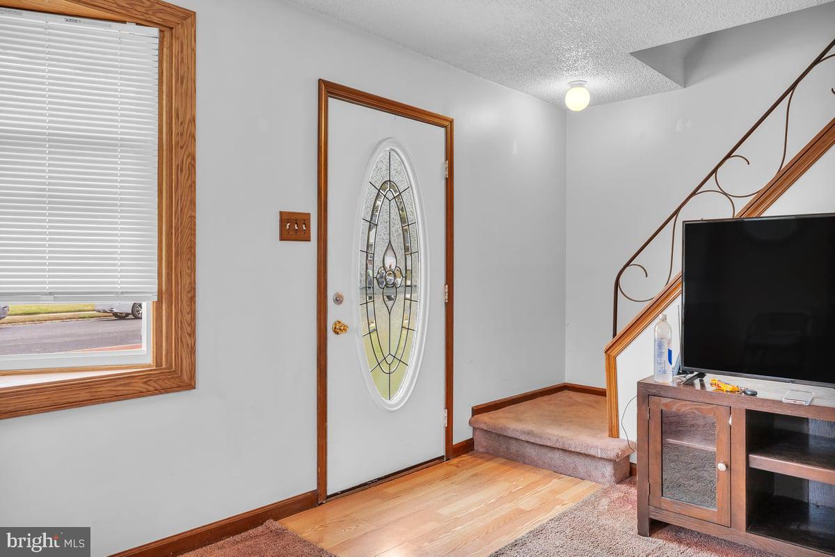 418 Westminster Road Wenonah, NJ 08090 - Photo 4 of 28 a living room with furniture and a flat screen tv