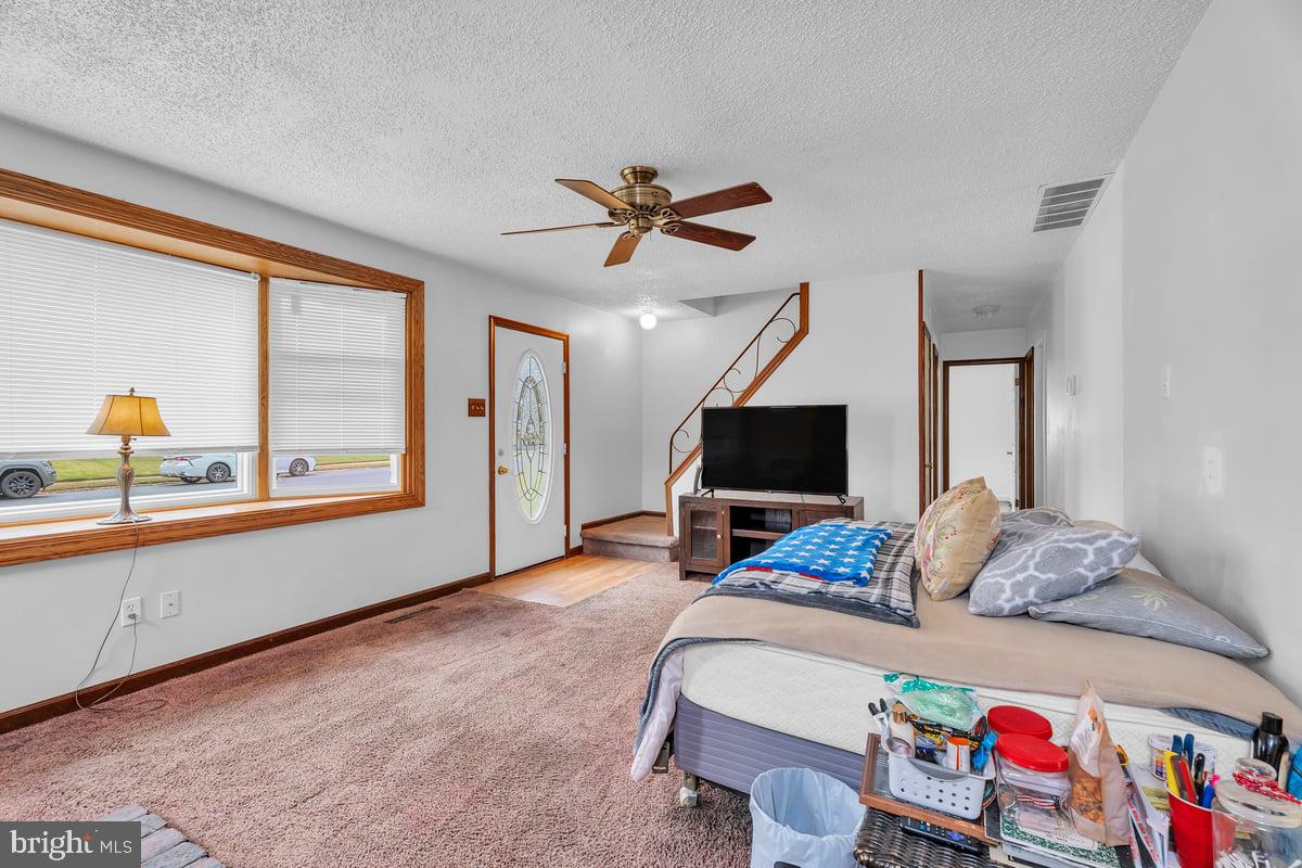 418 Westminster Road Wenonah, NJ 08090 - Photo 7 of 28 a bedroom with a bed and a flat screen tv