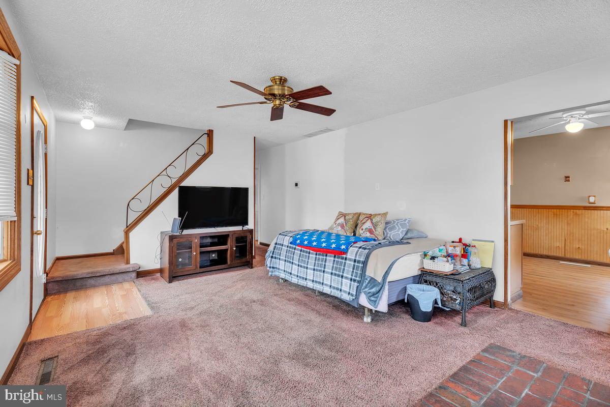 418 Westminster Road Wenonah, NJ 08090 - Photo 8 of 28 a living room with furniture and a flat screen tv