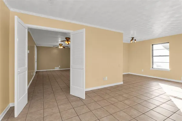 a view of an empty room and window