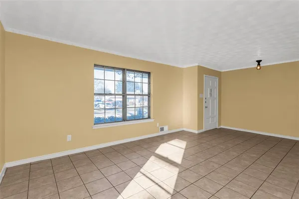 a view of an empty room with window