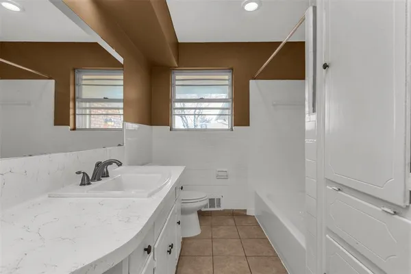 a bathroom with a sink and a bathtub