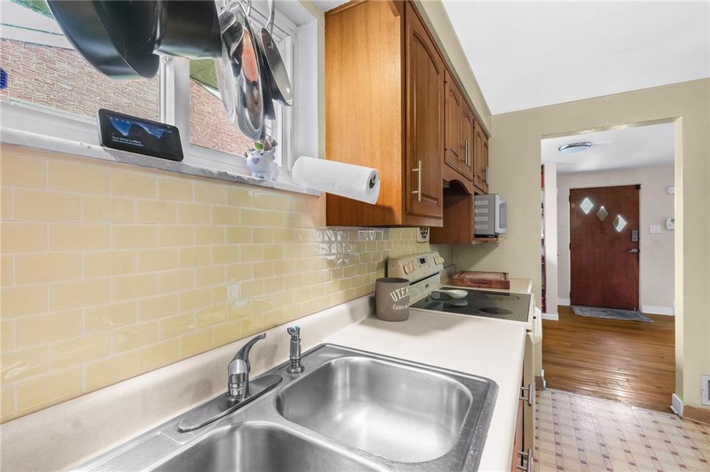1654 Hollyrood Road Pittsburgh, PA 15227 - Photo 23 of 33 a bathroom with a sink a toilet and mirror