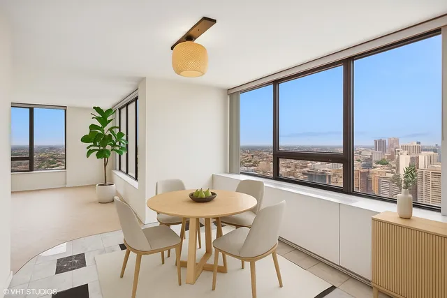 a dining room with furniture and window