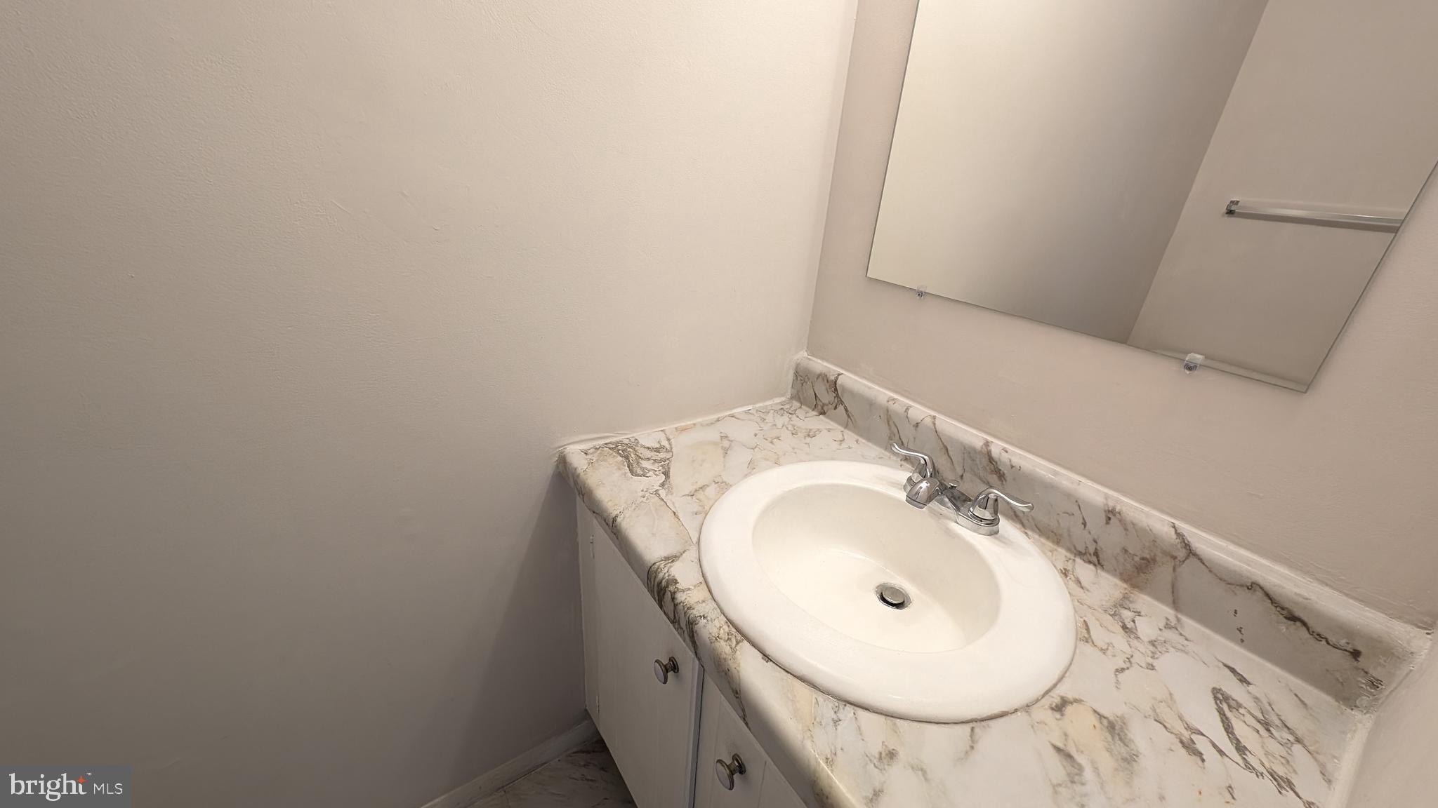 43 Vienna Court Frederick, MD 21702 - Photo 15 of 38 a bathroom with a sink and a mirror
