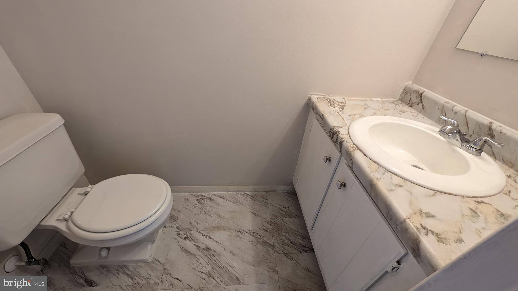 43 Vienna Court Frederick, MD 21702 - Photo 16 of 38 a bathroom with a toilet sink and mirror