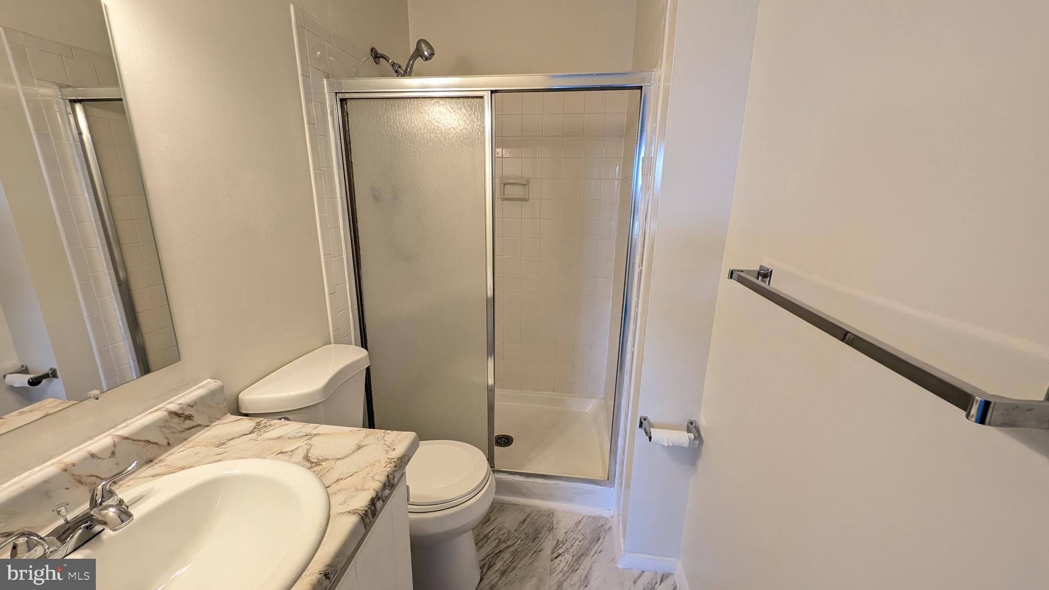 43 Vienna Court Frederick, MD 21702 - Photo 20 of 38 a bathroom with a granite countertop sink toilet and shower