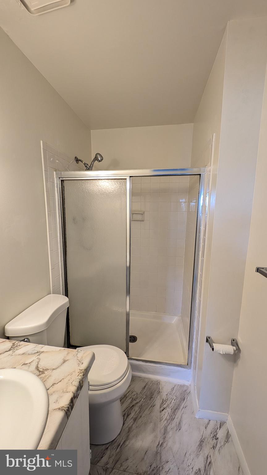 43 Vienna Court Frederick, MD 21702 - Photo 23 of 38 a bathroom with a toilet and a shower