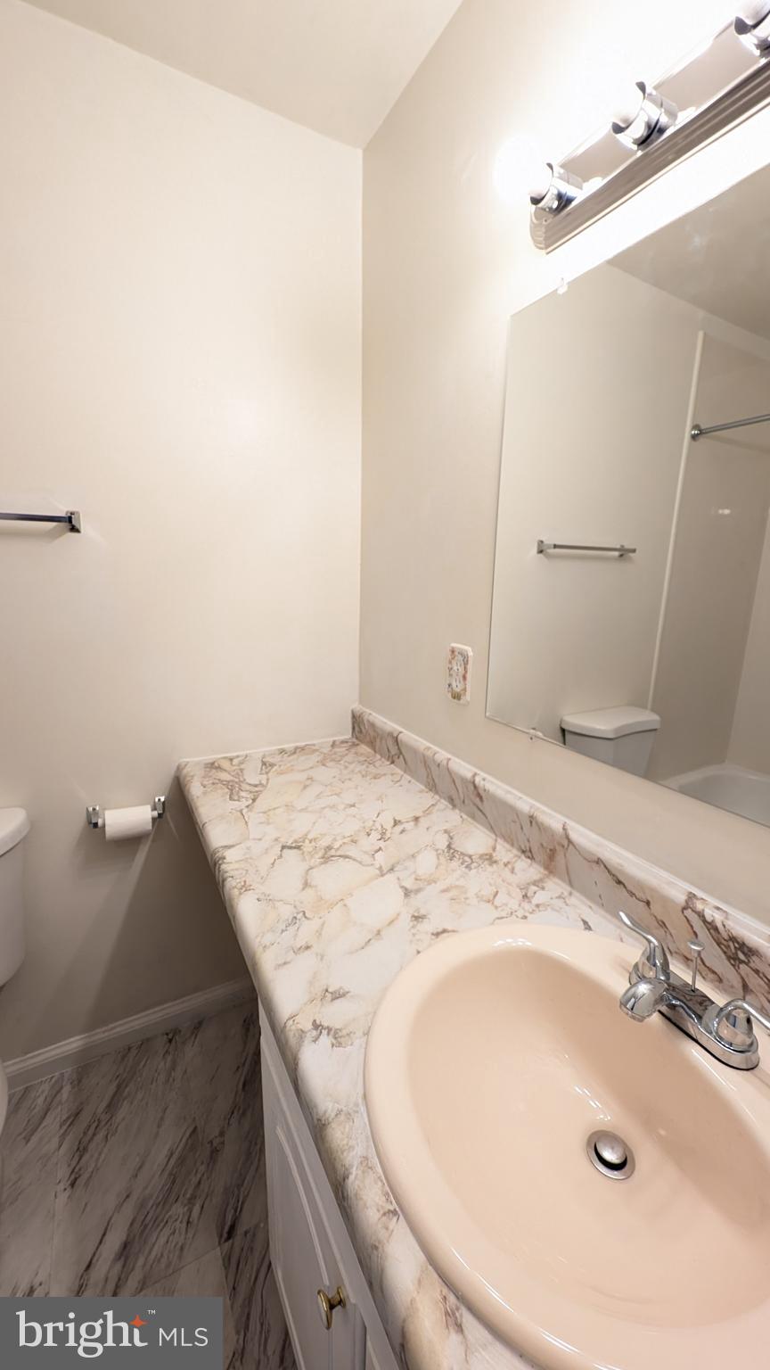 43 Vienna Court Frederick, MD 21702 - Photo 27 of 38 a bathroom with a sink and a mirror
