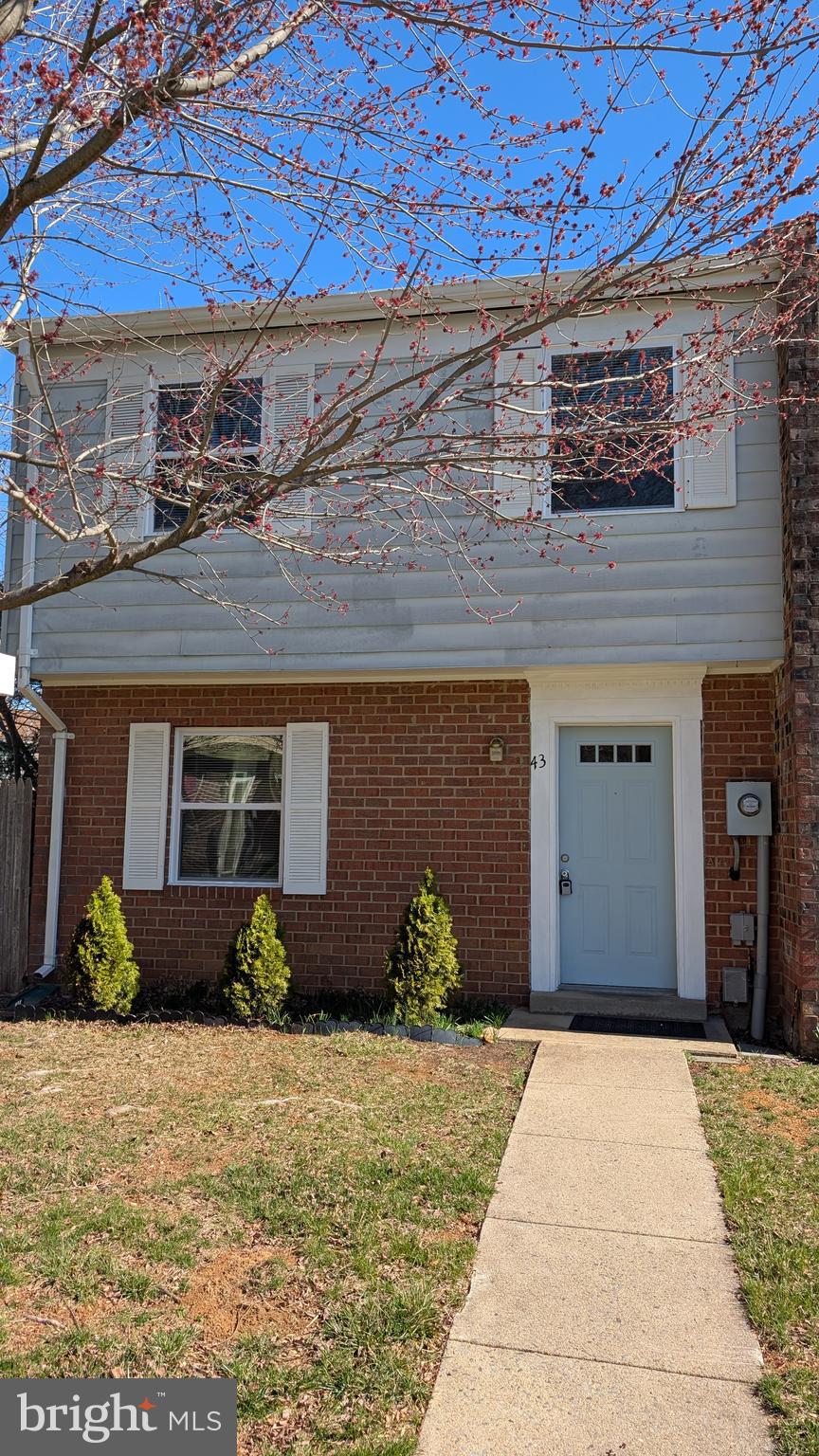 43 Vienna Court Frederick, MD 21702 - Photo 3 of 38 a front view of a house with a yard