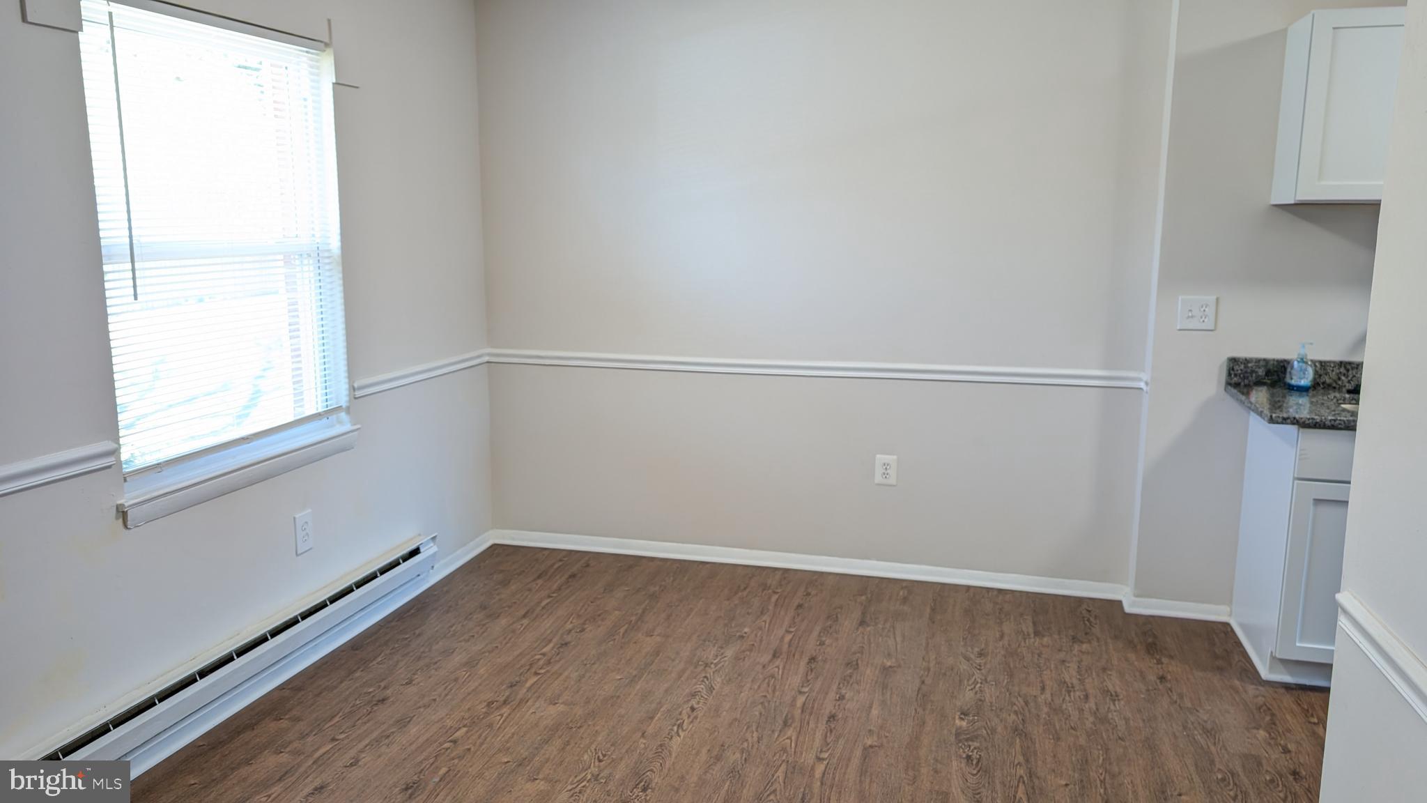 43 Vienna Court Frederick, MD 21702 - Photo 7 of 38 a view of a room with wooden floor and fan