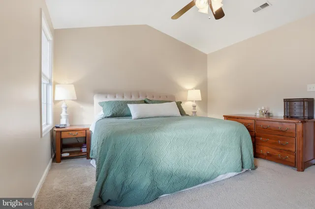 a bedroom with a bed and cabinets