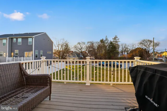 a view of a house with a large window and wooden floor