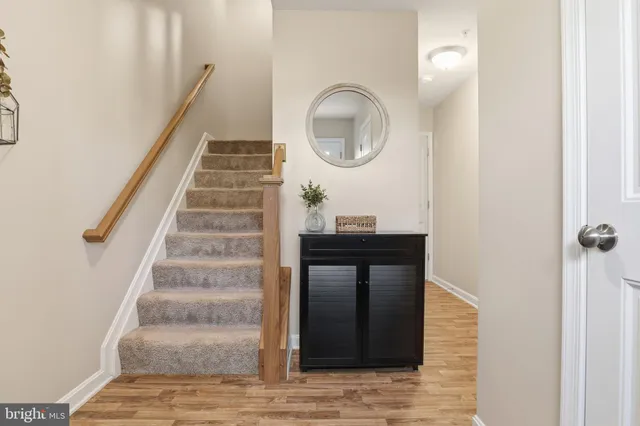 a bathroom with a sink toilet and a mirror