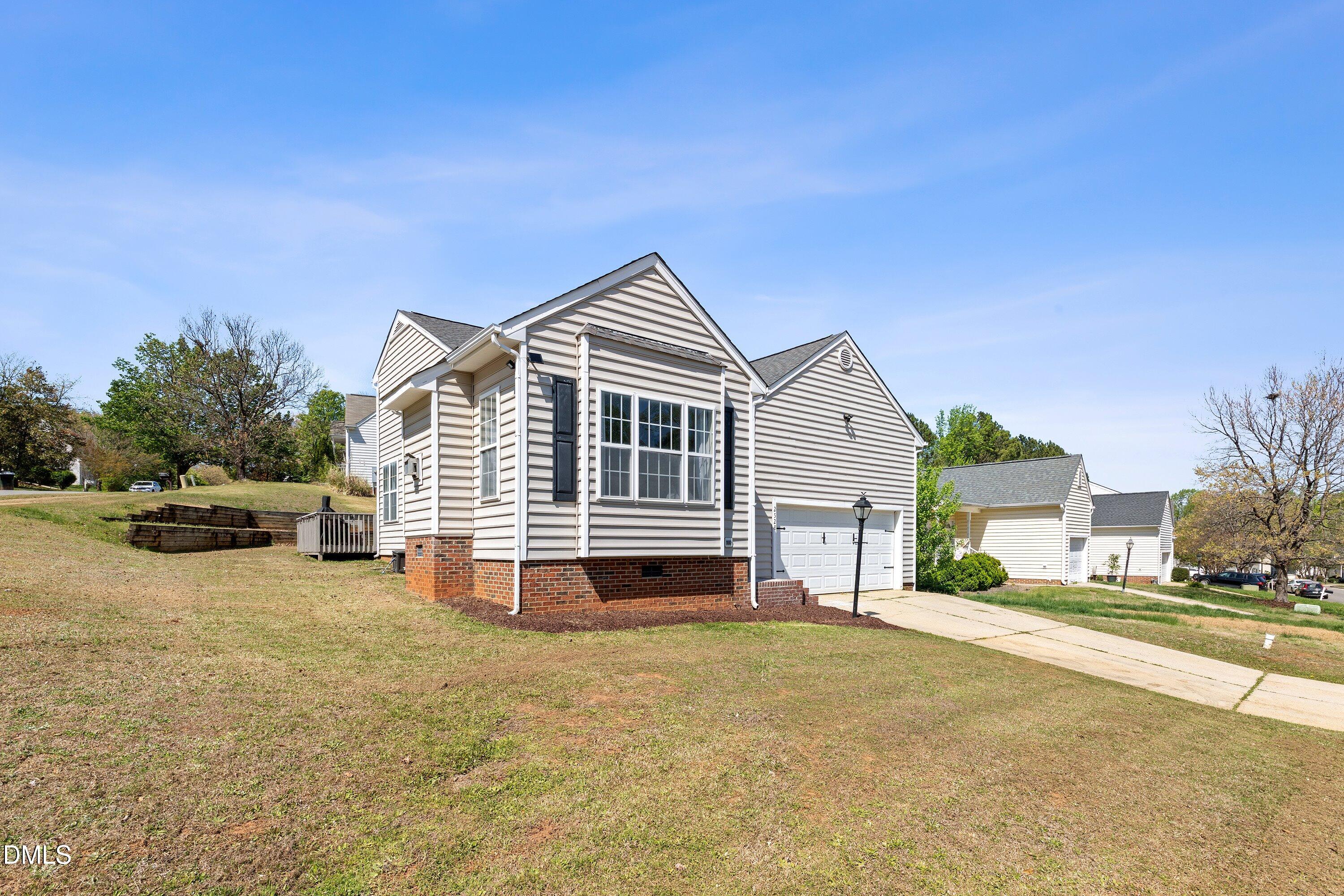 2528 Laurel Falls Lane Raleigh, NC 27603 - Photo 2 of 50 Front Exterior Angled Far