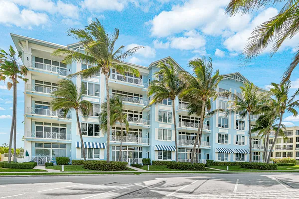 a view of a palm trees in front of a building