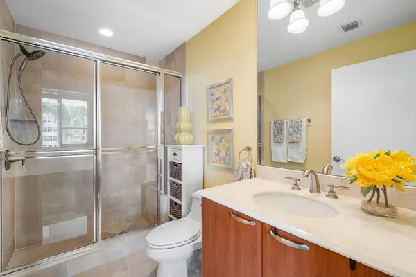 a view of a bathroom with a tub and shower