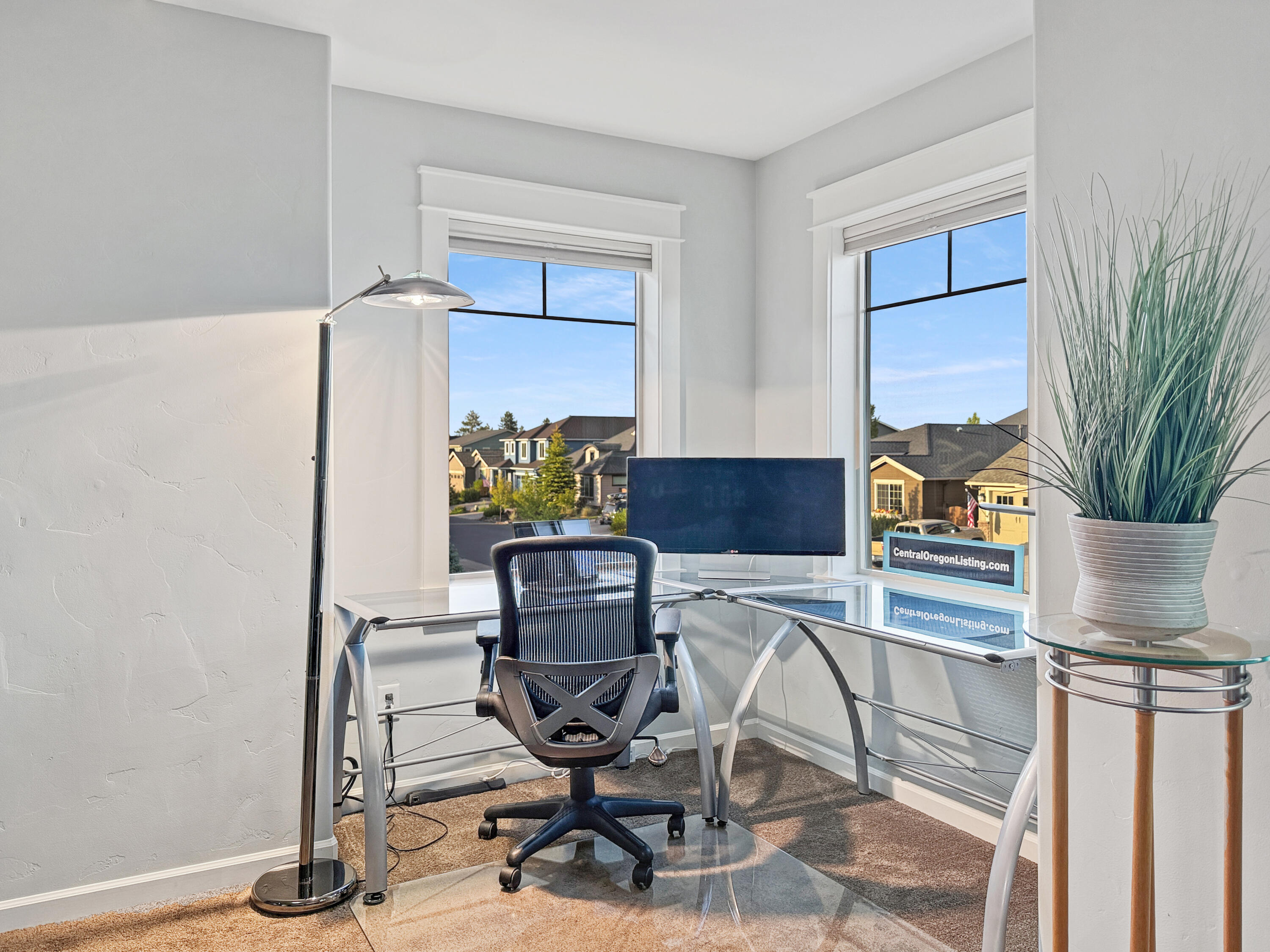 61072 Manhae Loop Bend, OR 97702 - Photo 28 of 63 a view of a workspace with furniture and a potted plant