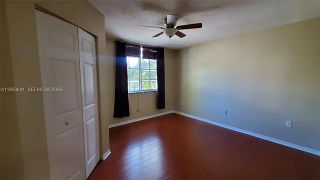 wooden floor in an empty room and a window