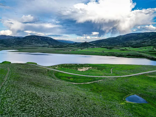 a view of a golf course with a lake