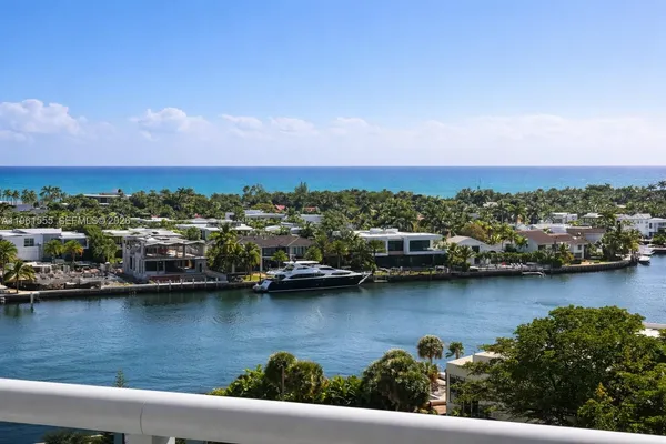 an aerial view of a houses with ocean view