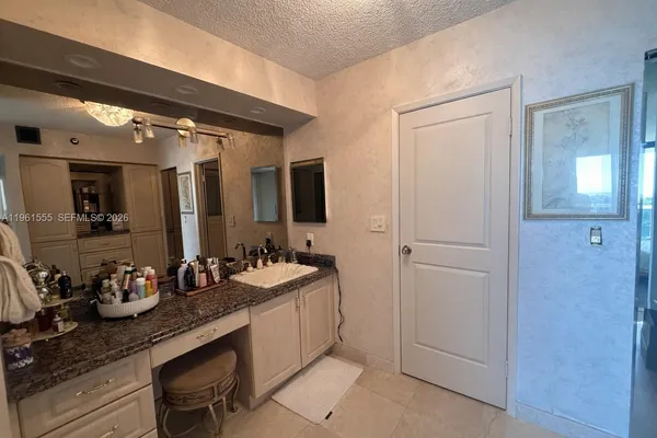 a bathroom with sink and mirror