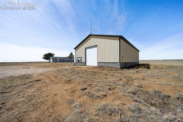 8160 Edison Road Yoder, CO 80864 - Photo 4 of 42 View of outdoor structure featuring a garage