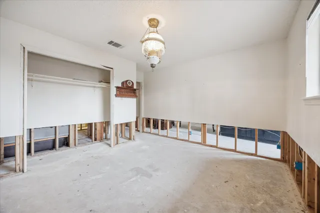 a view of an empty room with stairs