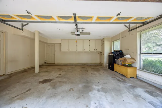 a view of a room with gym equipment and windows