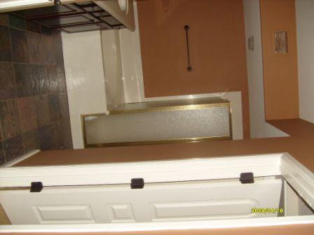 3935 East Rough Rider Road, Unit 1143 Phoenix, AZ 85050 - Photo 7 of 7 a view of a bathtub in a glass door