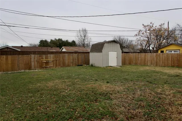 a view of a backyard of the house