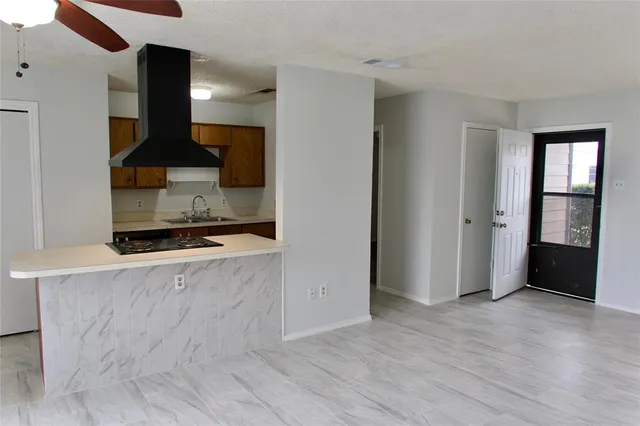an entryway with wooden floor