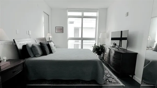 a room with bed and window