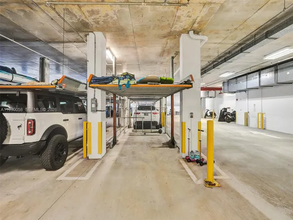a view of a dining room with furniture large windows and wooden floor