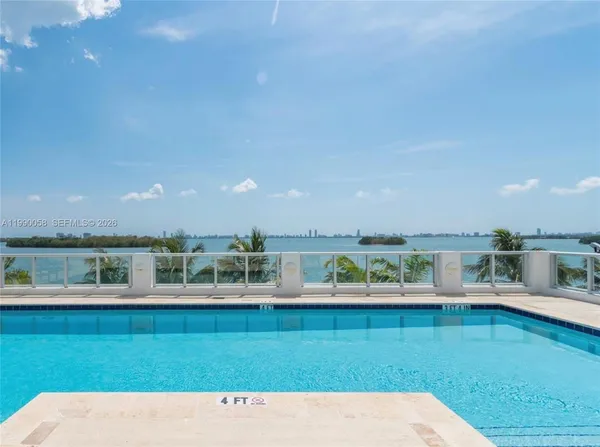 a view of a palm trees front of house