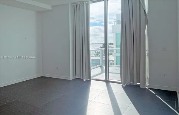 an empty room with windows