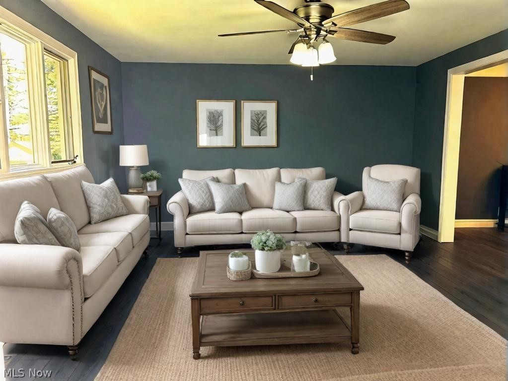 1112 Brainard Road Lyndhurst, OH 44124 - Photo 11 of 34 Living room featuring ceiling fan and dark luxury vinyl style flooring. Photo Virtual Staged.