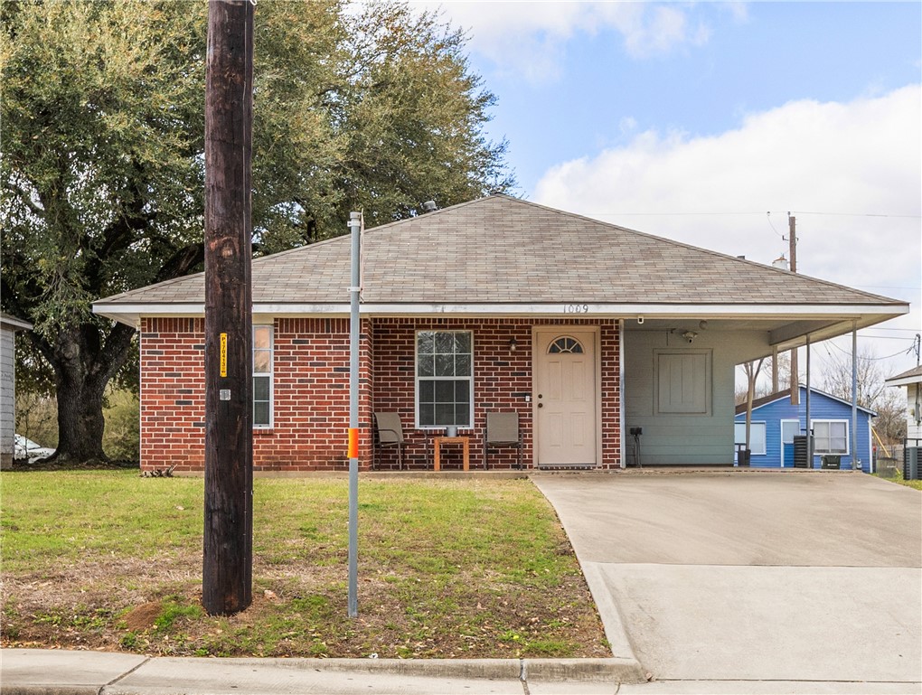 1009 West 17th Street Bryan, TX 77803 - Photo 1 of 11 a front view of a house with garden