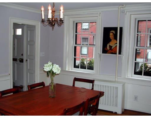 43 South Russell Boston, MA 02114 - Photo 3 of 8 a view of a dining room with a table and chairs